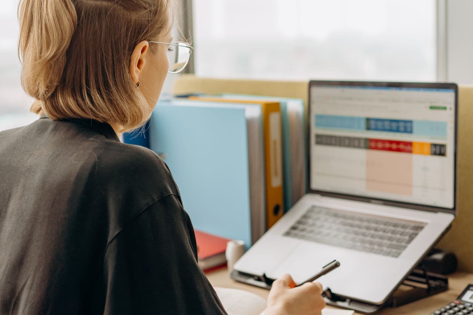 Person reviewing a table on a laptop
